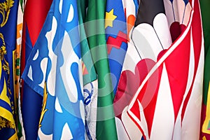 Flags of the Siena contrade districts, Palio festival background, in Siena, Tuscany Italy