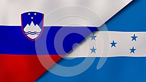 The flags of Slovenia and Honduras. News, reportage, business background. 3d illustration