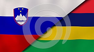 The flags of Slovenia and Mauritius. News, reportage, business background. 3d illustration
