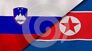 The flags of Slovenia and North Korea. News, reportage, business background. 3d illustration