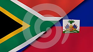 The flags of South Africa and Haiti. News, reportage, business background. 3d illustration