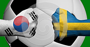 Flags of South Korea and Sweden painted on two clenched fists facing each other with closeup 3d soccer ball in the background/Socc