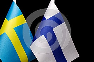 Flags of Sweden and Finland, close together, concept of state relations