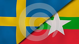 The flags of Sweden and Myanmar. News, reportage, business background. 3d illustration