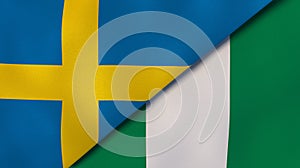 The flags of Sweden and Nigeria. News, reportage, business background. 3d illustration