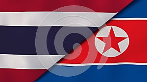 The flags of Thailand and North Korea. News, reportage, business background. 3d illustration