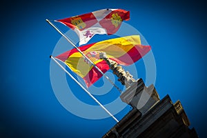 Flags to the wind with blue sky photo