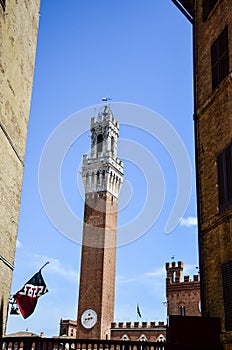 Flags and tower in Siena, Italy