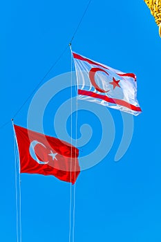 Flags of Turkey and Republic of Northern Cyprus waving between steeples of Selimiye mosque at Lefkosa, Cyprus