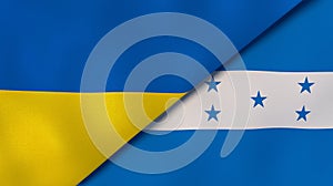 The flags of Ukraine and Honduras. News, reportage, business background. 3d illustration