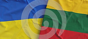 Flags of Ukraine and Lithuania. Linen flags close up. Flag made of canvas. Ukrainian. Lithuanian, Vilnius. National symbols. 3d