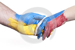 Flags of Ukraine and Russia Flag on hands isolated on white background. Concept of political, economical, social aggressions,