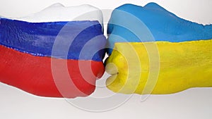 Flags of Ukraine and Russia Flag on hands punch to each other on white background, Ukraine vs Russia in world war crisis concept.
