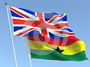 The flags of United Kingdom and Ghana on the blue sky. For news, reportage, business. 3d illustration