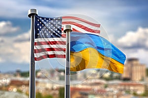 Flags of United states of America and Ukraine against Kyiv on ba