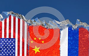 The flags of the United States, China and Russia are narsovany on a piece of ice in the form of an Arctic iceberg against blue sky