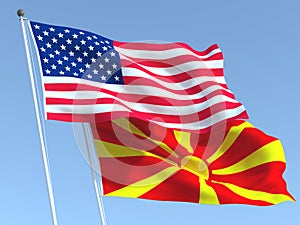 The flags of United States and Macedonia on the blue sky. For news, reportage, business. 3d illustration