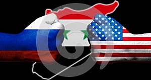 Flags of the United States and Russia painted on two clenched fists facing each other with outline map of Syria on black backgroun