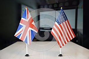 flags of United States and United Kingdom. international negotiations. conclusion of contracts between countries. concept of photo
