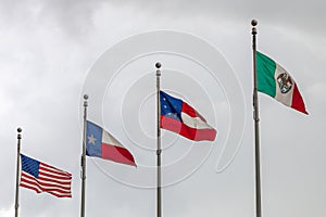 Flags of the Untied States of America, the state of Texas, the first official national flag of the Confederacy and of Mexico again photo