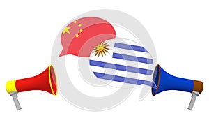 Flags of Uruguay and China on speech bubbles with loudspeakers. Intercultural dialogue or international talks related 3D