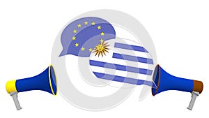 Flags of Uruguay and the European Union on speech bubbles with loudspeakers. Intercultural dialogue or international