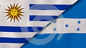 The flags of Uruguay and Honduras. News, reportage, business background. 3d illustration