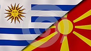 The flags of Uruguay and Macedonia. News, reportage, business background. 3d illustration