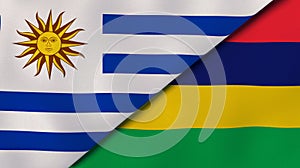 The flags of Uruguay and Mauritius. News, reportage, business background. 3d illustration