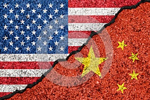 Flags of USA and China painted on cracked wall background/USA-China trade war concept