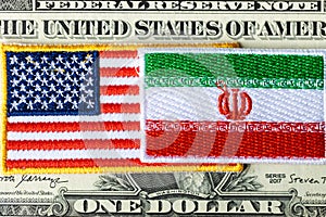 Flags of the USA and Iran against the background of the US dollar, financial concept, the impact of mutual relations and the US