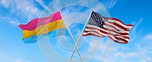 flags USA and Pansexuality Pride waving in the wind on flagpole against the sky with clouds on sunny day. 3d illustration