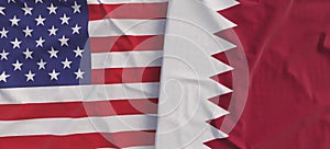 Flags of USA and Qatar. Linen flag close-up. Flag made of canvas. United States of America. Doha. State national symbols. 3d