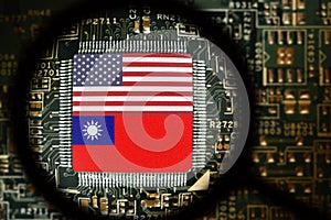 Flags of USA and Taiwan on a processor. Computer board with chip.