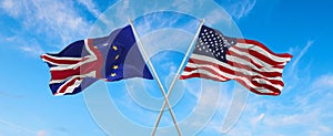 flags of USA, Union Jack, European Union waving in the wind on flagpoles against the sky with clouds on sunny day. Symbolizing