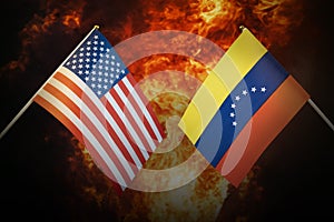 Flags of venezuela and United States of america against background of a fiery explosion. The concept of enmity and war