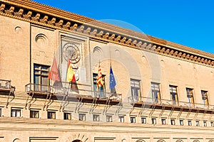 Flags of Zaragoza, Spain, Aragon and the European Union near the building of the City Hall of Zaragoza, Spain.