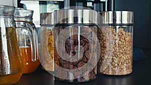 Flakes glass jars nutritious breakfast deliciousness wellness. Cereal flakes oats muesli convenient wholesome start day