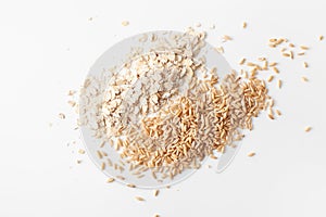 Flakes and peeled oat grains pile