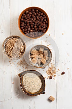 Flakes, sugar, seeds semi-cook for porridge close up in white key