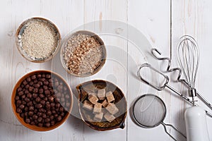 Flakes, sugar, seeds semi-cook for porridge close up in white key