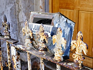 Flaking Paint on Old Metal Post Fence and Mail Box