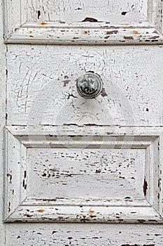 Flaking white paint on door