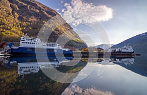 Flam village with Two cruise at the port during early morning