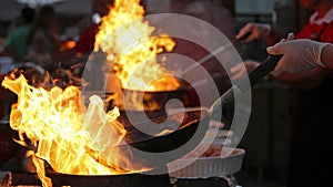 Flambe Chef Cooking in Outdoor Kitchen