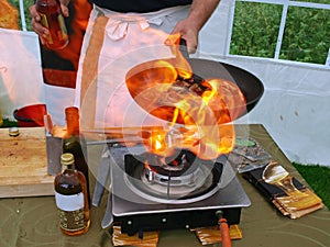 Flambe cook in flames photo