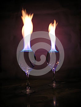 Flame above glasses.