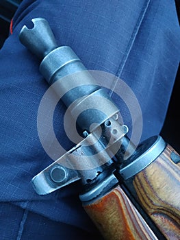 The flame arrester and the forend of a Kalashnikov assault rifle close-up