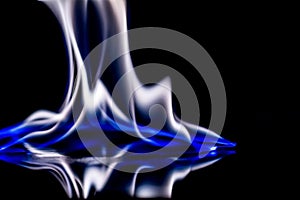 Flame of blue fire with reflect