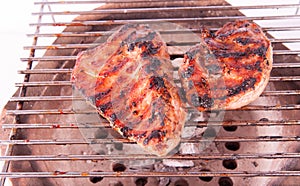 Flame broiled steak on a grill